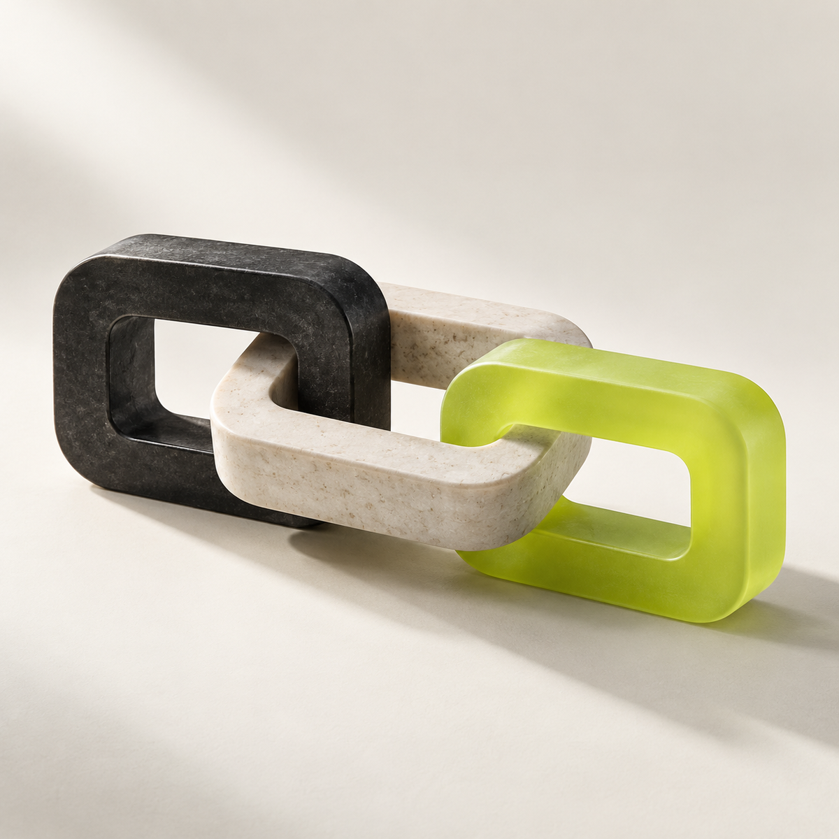 Systems integration represented by three interlocking charcoal, ivory and lime loops.